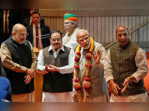 New Delhi: Prime Minister Narendra Modi being felicitated by BJP National Presid...