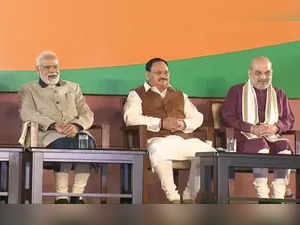 New Delhi :Prime Minister Narendra Modi, BJP National President JP Nadda and Union Home Minister Amit Shah during the celebrations of the party's victory in the Gujarat Assembly elections at BJP Headquarters in New Delhi on Thursday, December 08, 2022. (Photo:IANS)