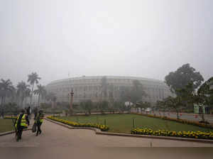 New Delhi: The Parliament House building, shrouded in a thick layer of fog, on a...