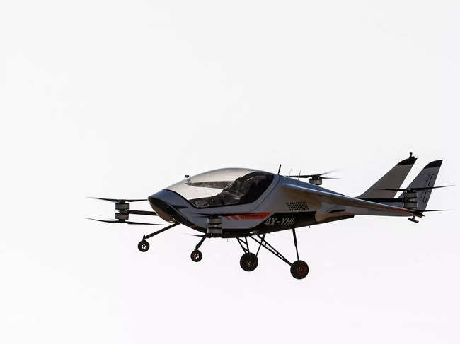 A prototype of AIR ONE, an electric vehicle developed by Israeli startup AIR and designed to fly commuters on short trips far above streets overcrowded with cars, flies untethered during a flight test above Beersheba