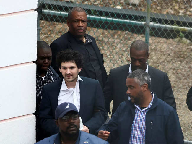 Sam Bankman-Fried, who founded and led FTX, escorted at court in Nassau