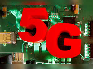 FILE PHOTO: 3d printed objects representing 5G are put on a motherboard in this picture illustration