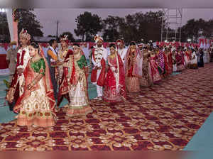 Surat: Brides and Grooms at a mass marriage ceremony in Surat, Saturday night, D...