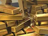 Gold prices edge up as dollar eases