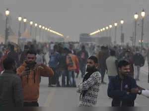 New Delhi: Visitors at India Gate during a cold winter day, in New Delhi, Thursd...