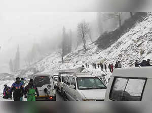 Manali: Tourists visit the Atal Tunnel amid fresh snowfall at Rohtang near Manal...