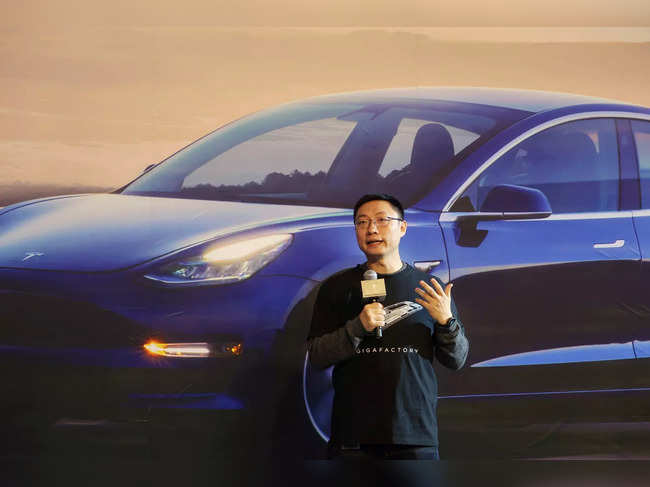FILE PHOTO: Tesla's China chief Tom Zhu speaks at a delivery ceremony for China-made Tesla Model 3 vehicles in the Shanghai Gigafactory of the U.S. electric car maker in Shanghai