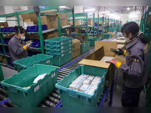 FILE PHOTO: Workers sort medicines at a logistics centre amid the COVID-19 outbreaks in Beijing