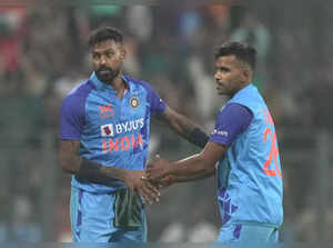 Mumbai: Indian player Shivam Mavi with Hardik Pandya celebrates the wicket of Sr...