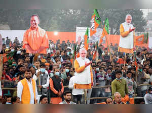 Prayagraj, Dec 26 (ANI): Bharatiya Janata Party (BJP) supporters holding cutouts...
