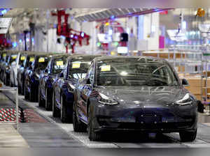 FILE PHOTO: Tesla China-made Model 3 vehicles are seen during a delivery event at its factory in Shanghai