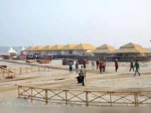 Varanasi: Temporary tents being installed for the tourists on the eve of New Yea...
