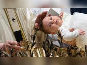 Pope Francis baptises babies in Sistine Chapel in Vatican City