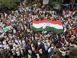 Supporters of Hazare march during a rally