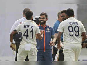 India's Ravichandran Ashwin, Shreyas Iyer and Virat Kohli celebrate their victor...