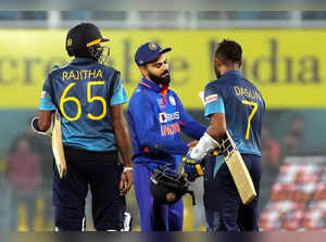 Guwahati: Sri Lankan batsman Dasun Shanaka with Indian cricketer Virat Kohli at ...
