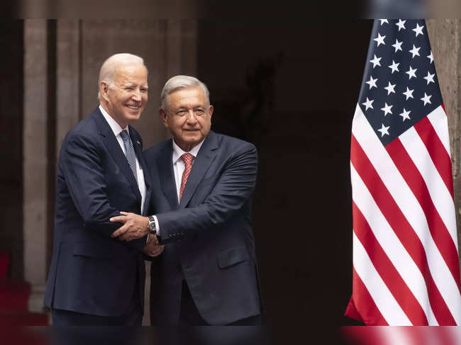 President Joe Biden is greeted by Mexican President Andres Manuel Lopez Obrador ...