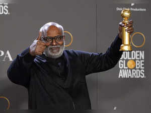 M.M. Keeravani poses in the press room with the award for best original song, mo...