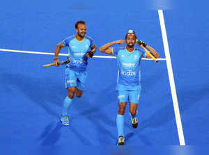 Rourkela: Hardik Singh (8) of India reacts after scoring a goal against Spain du...