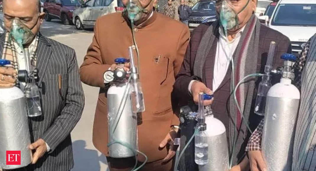 Watch: BJP MLAs arrive at Delhi Assembly carrying oxygen cylinders as a protest against AAP govt, air pollution