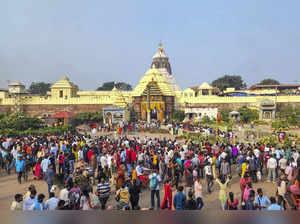 Puri: Devotees throng the Shree Jagannath temple on the New Year day, in Puri. (...