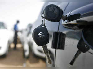 Keys hang from door of Maruti Suzuki Swift car at its stockyard on the outskirts of the western Indian city of Ahmedabad