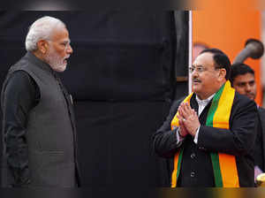 New Delhi: Prime Minister Narendra Modi being greeted by BJP National President ...