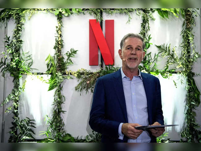 (FILES) In this file photo taken on January 17, 2020 Co-founder and director of Netflix Reed Hastings delivers a speech as he inaugurates the new offices of Netflix France, in Paris. Netflix announced January 19, 2023 that its founder Reed Hastings is stepping down as co-CEO at the company and will serve as executive chairman. Hastings will be replaced by co-CEOs Ted Sarandos and Greg Peters.  (Photo by Christophe ARCHAMBAULT / AFP)