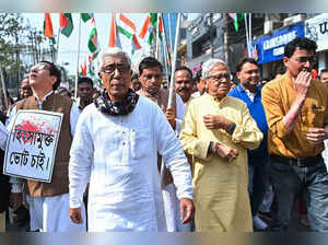 Agartala : Leader of opposition in Tripura Assembly Manik Sarkar with AICC in-charge Tripura, Ajoy Kumar and Samir Barman others during a protest rally in Agartala on Saturday, Jan 21, 2023. (Photo:Abhisek Saha/IANS)