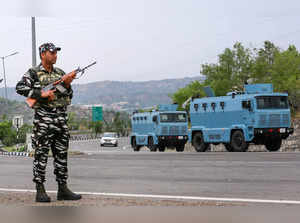 Jammu: A CRPF personnel stands guard at the Jammu–Srinagar National Highway as s...