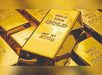 Gold prices hover near 9-month peak