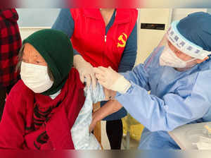 FILE PHOTO: Coronavirus disease (COVID-19) vaccination to elderly people at a vaccination center on the outskirts of Shanghai