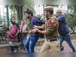 New Delhi: Delhi Police personnel detain a student after Students' Federation of...