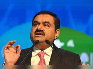 (FILES) In this file photo taken on November 19, 2022, Chairperson of Indian conglomerate Adani Group, Gautam Adani, speaks at the World Congress of Accountants in Mumbai. Trading in the business empire of Asia's richest man Gautam Adani was halted on January 27, 2023 following a 15 percent plunge in its share price, days after a US investment firm claimed it had committed "brazen" corporate fraud. (Photo by INDRANIL MUKHERJEE / AFP)