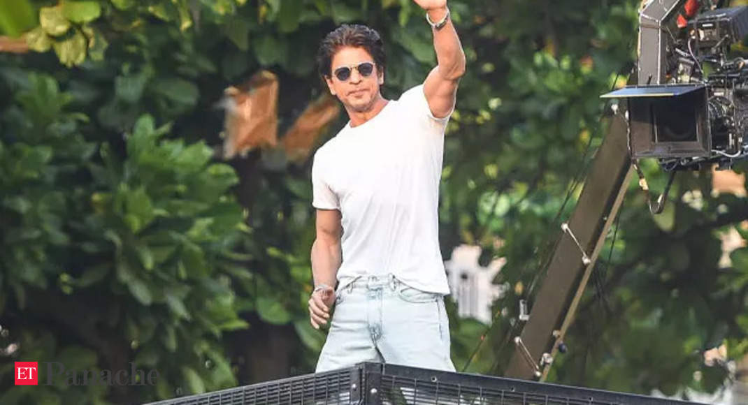 In pics: 'Pathaan' star Shah Rukh Khan shakes hands, blows flying