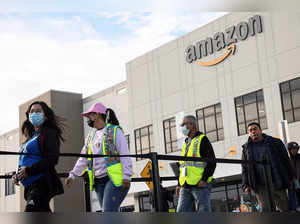 FILE PHOTO: Workers stand in line to cast ballots for a union election at Amazon's JFK8 distribution center, in Staten Island, New York City