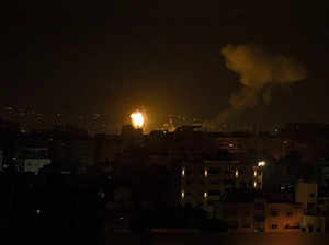 Fire and smoke rises following an Israeli airstrike in central Gaza Strip. Gaza ...