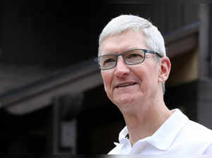 FILE PHOTO: Tim Cook, CEO of Apple, attends the annual Allen and Co. Sun Valley media conference in Sun Valley, Idaho