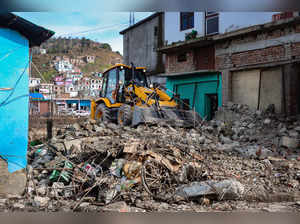 Poonch: A JCB during the anti-encroachment drive in Mendhar area of Poonch. (PTI...