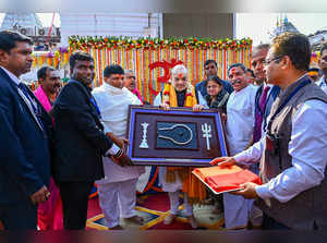 Deoghar: Union Home Minister Amit Shah being felicitated during his visit to Bab...