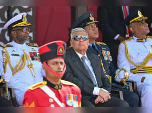 Sri Lanka's President Ranil Wickremesinghe (C) watches Sri Lankan Army soldiers parade during Sri Lanka's 75th Independence Day celebrations in Colombo on February 4, 2023. (Photo by ISHARA S. KODIKARA / AFP)