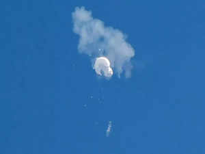 The suspected Chinese spy balloon drifts to the ocean after being shot down off the coast in Surfside Beach.