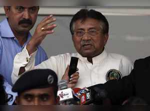 Pakistan's former President, Pervez Musharraf, addresses his supporters after his arrival from Dubai at Jinnah International airport in Karachi