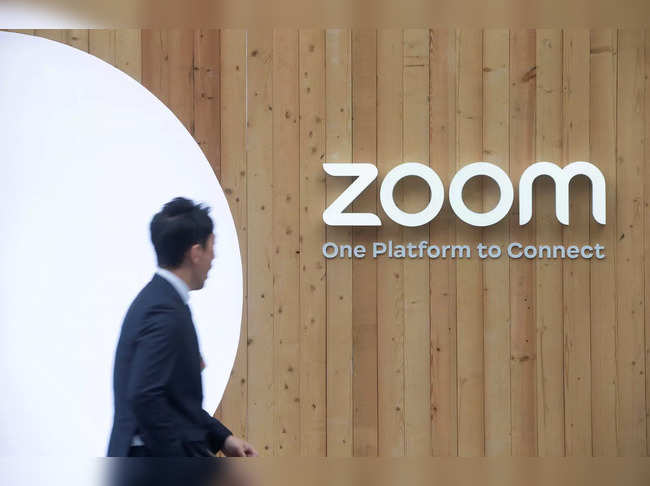 A man walks past a temporary show room of Zoom during the World Economic Forum in Davos