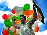 A volunteer celebrates in Lucknow