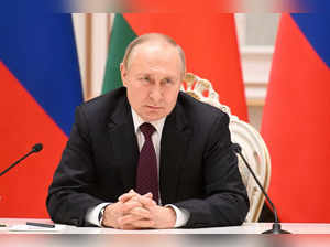 FILE PHOTO: Russian President Vladimir Putin attends a news conference in Minsk