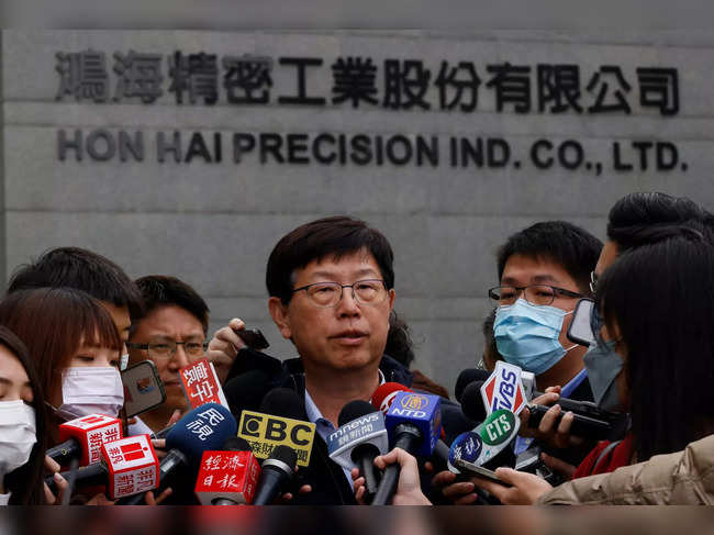 Foxconn Chairman Liu Young-way talks to members of the media after leading a new year prayer in front of the company’s building in New Taipei City