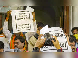 Kolkata_ BJP MLAs display placards after they walked out during West Bengal Gove....