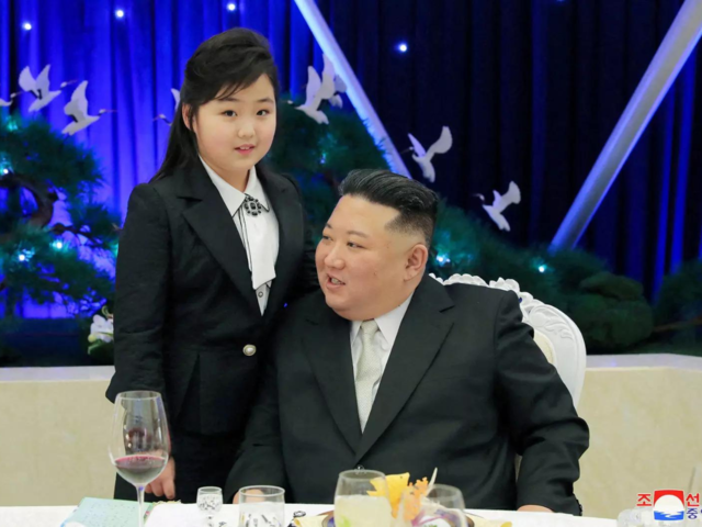 Kim Jon Un with daughter