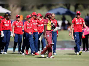 West Indies' Stafanie Taylor (C) walks back to the pavilion after her dismissal by England's Sarah Glenn during the Group B T20 women's World Cup cricket match between West Indies and England at Boland Park in Paarl on February 11, 2023. (Photo by Marco Longari / AFP)